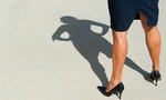 Sexy high heel legs of confident, determined, dominant and successful woman, visible in isolated shadow on the concrete floor outdoor, with lots of copy space. — Photo by roboriginal