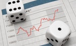 Pair of dice on stock chart.