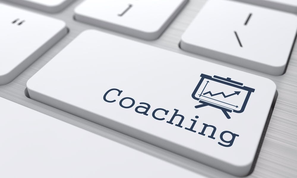 Business Concept. "Coaching" Button on Modern Computer Keyboard.