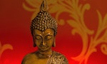 Buddha statue with red  background