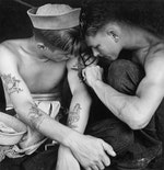Tattooed_sailor_aboard_the_USS_New_Jerse