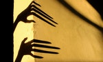 Strange Shadows On The Wall.Terrible Shadows. Abstract Background. Black Shadows Of A Big Hands On The Wall. Silhouette Of A Hands On The Wall. Nightmares. Scary Dreams. - Image