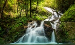 soft water of the stream in the natural park, Beautiful waterfall in rain forest ( Maekampong Waterfall, Thailand)