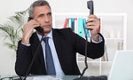 Businessman_on_two_telephone_calls