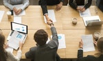 Businessmen shaking hands sitting at conference table during team meeting, two male entrepreneurs handshaking making deal starting collaboration at group negotiations teamwork, top view from above - 圖