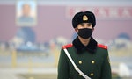 BEIJING, CHINA - DECEMBER 20, 2015: A Chinese military man wears a face mask at Tiananmen Square. Beijing issued a red alert for air pollution on Friday, its second red alert this month. - Image