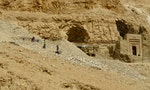 Egyptian archaeologists digging in the Valley of the Kings