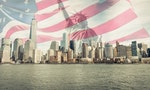 triple exposure of New york city skyline, liberty statue and american flag