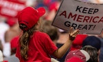 Manchester, NH - August 15, 2019: Young girl on shoulders of her father listens President Donald Trump speech at MAGA rally at Southern New Hampshire University