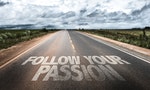 Follow Your Passion written on rural road