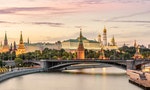 Moscow Kremlin at Moskva River, Russia. Panorama of old Moscow in summer evening. Scenic warm view of the ancient Moscow Kremlin at sunset. Beautiful cityscape of the famous Moscow center.
