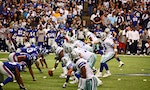 DALLAS - DEC 14: Dallas Cowboys Quarterback Tony Romo points to a New York Giants defender as he calls signals. Taken in Texas Stadium on Sunday, December 14, 2008.