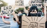 People from different culture and races protest on the street for equal rights wearing protective masks - Focus on asian girl face